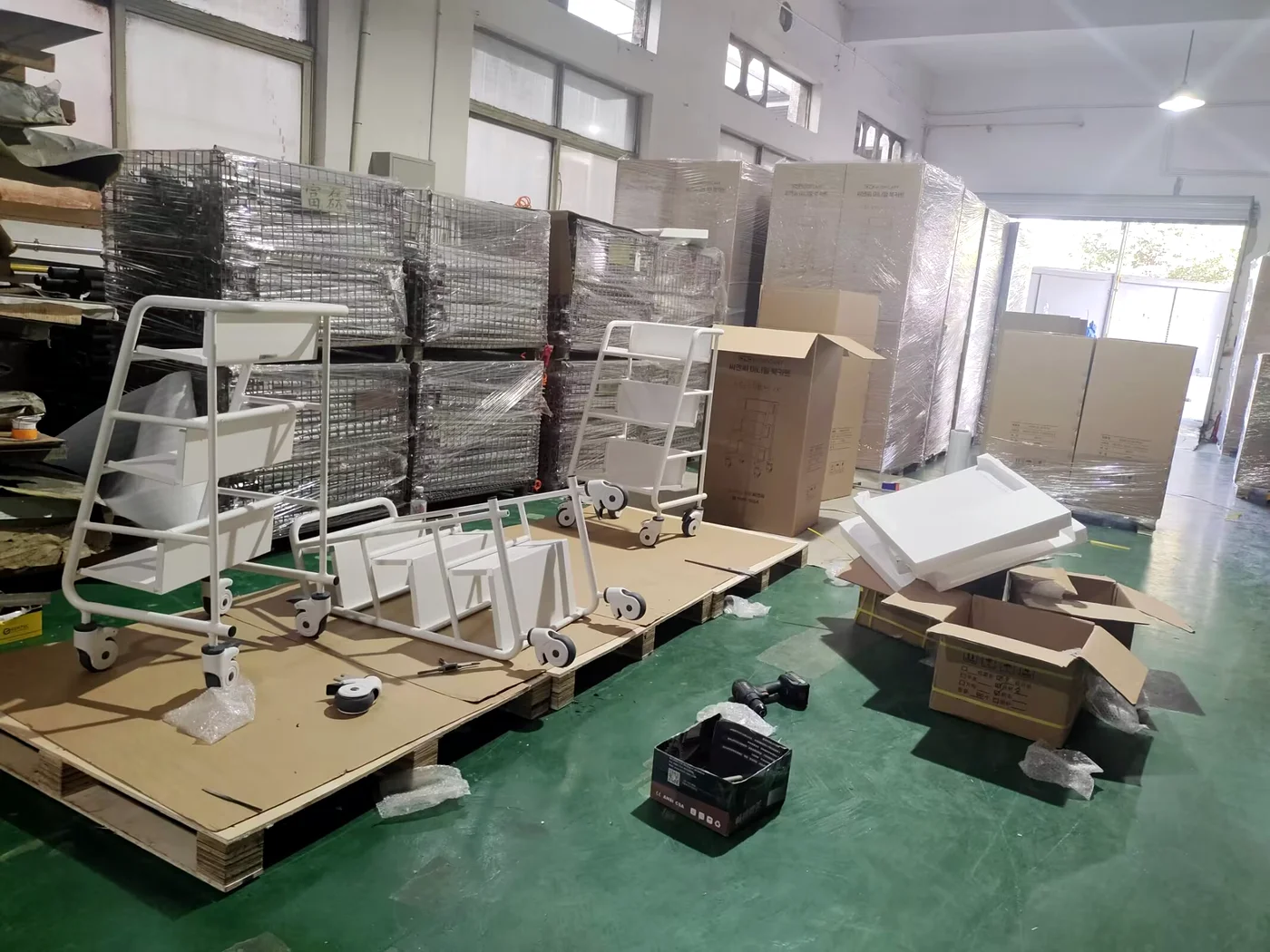 Aluminium shelves assembled onto a steel tube book trolley frame