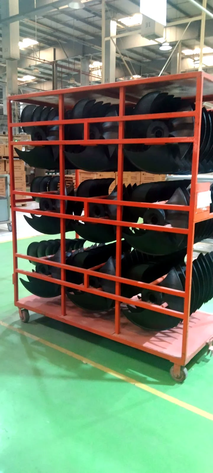 Side view of a custom rack trolley for formed parts on the shop floor