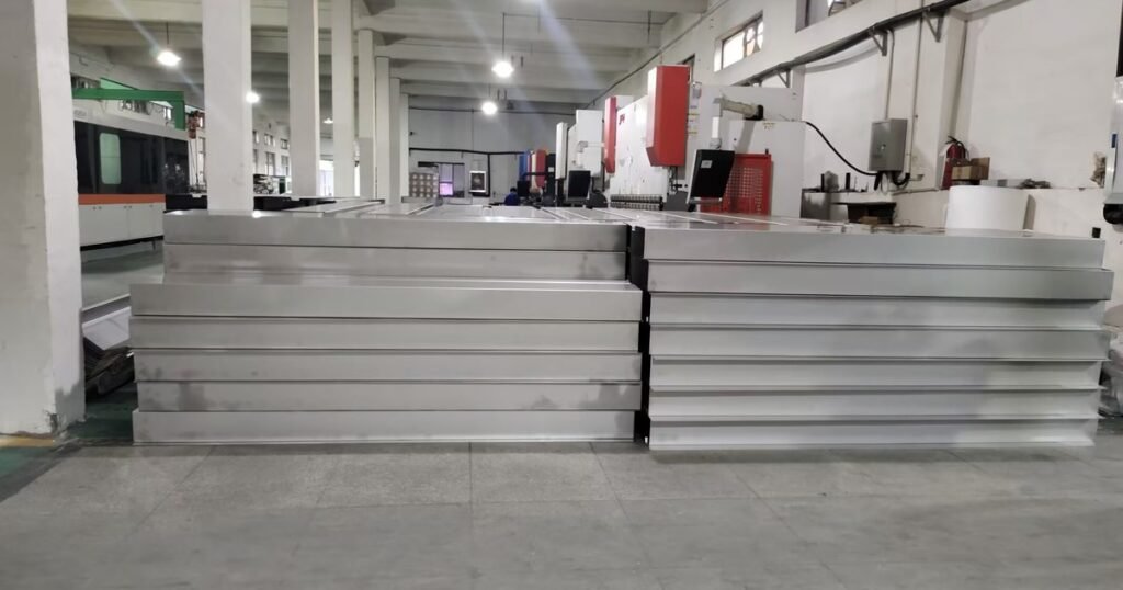 Sheet metal bending workshop with formed steel panels at the Doing Metal factory in Ningbo