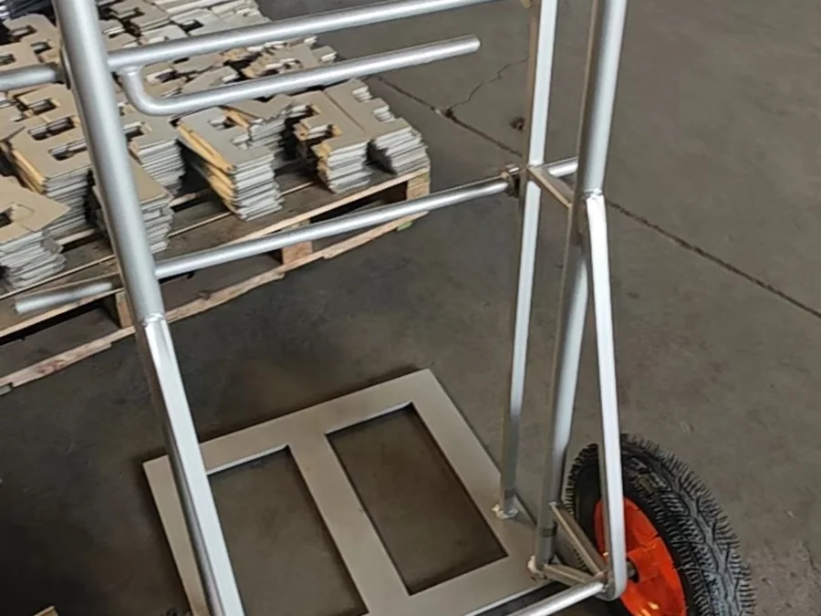 Galvanised steel trolley frame with plate deck and a pneumatic wheel for uneven floors