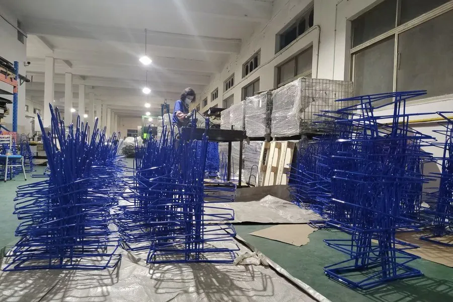 Batch of stainless steel trolleys during production inspection