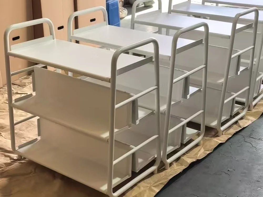 Batch of three tier warehouse picking trolleys before dispatch
