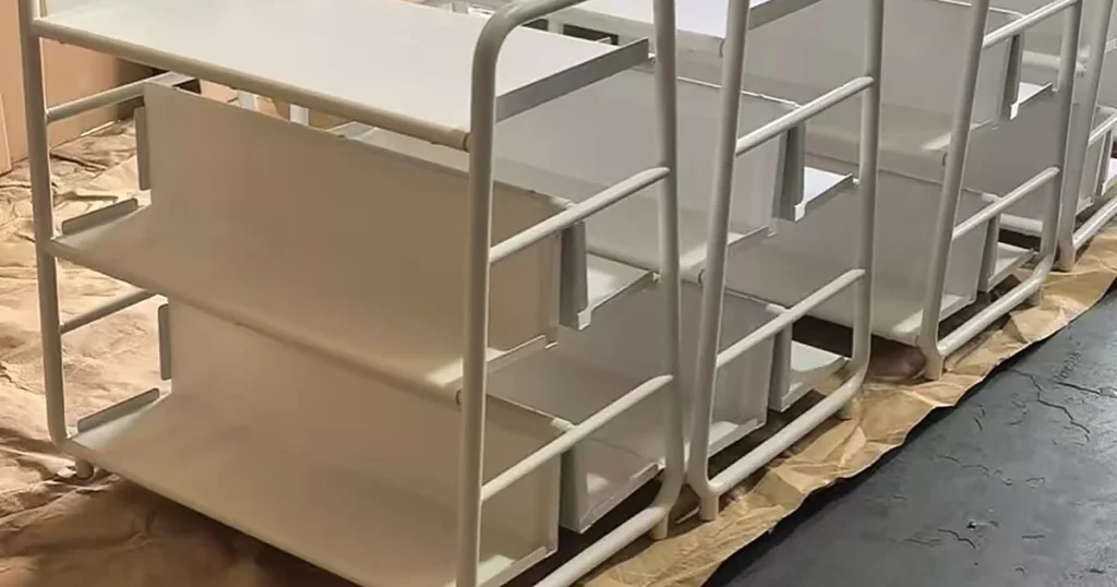 Row of finished three-tier platform trolleys with swivel casters